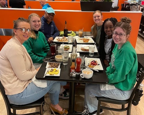 Photo: Breakfast--From left to right, clockwise:  History Student Adrienne Hall, Indigo Graves, Dr. Cicero Fain, Abby Christian, Nicole Asamoah, Lauren Dunsmore.