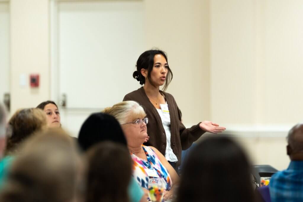 women talking at a conference