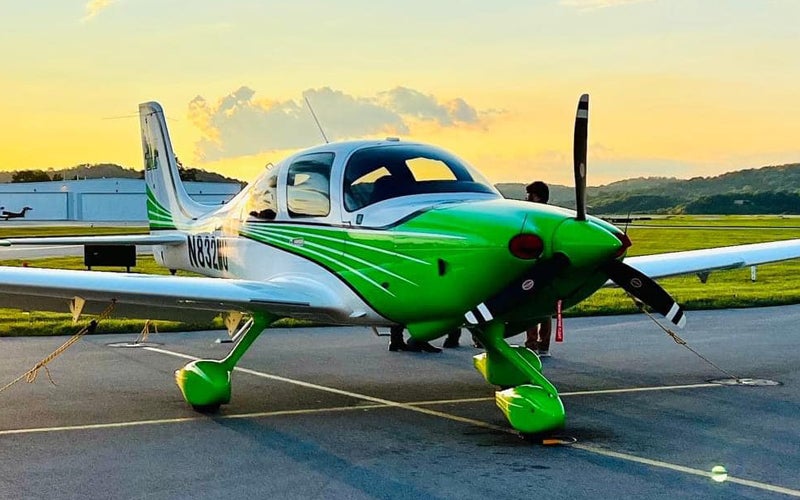 Marshall University Aviation branded airplane at sunset