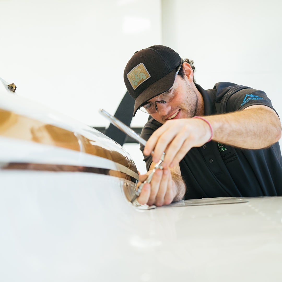 Marshall University Aviation Maintenance Technology student works on an aircraft