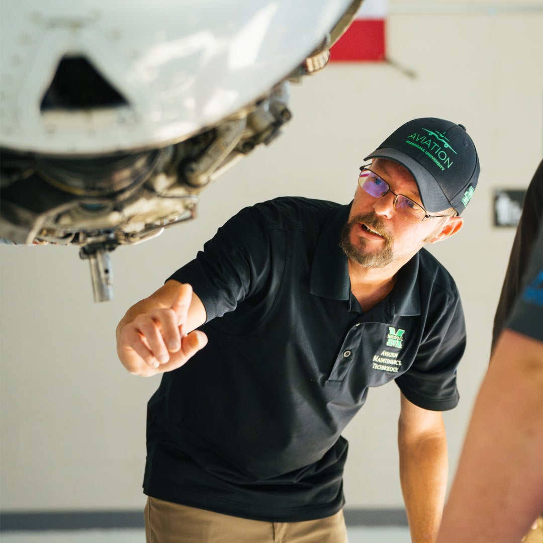 Marshall University Aviation Maintenance Technology student works on an aircraft