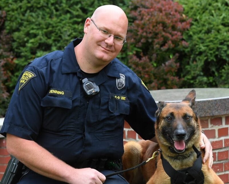 Officer Joe Denning with a K9 on campus