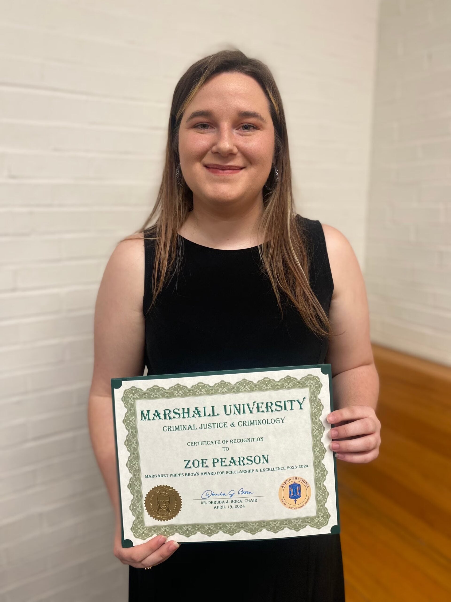 Zoe Pearson with a certificate