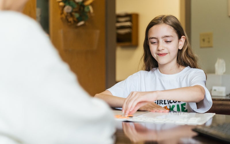 A young student receives academic tutoring through Marshall University's Community HELP program