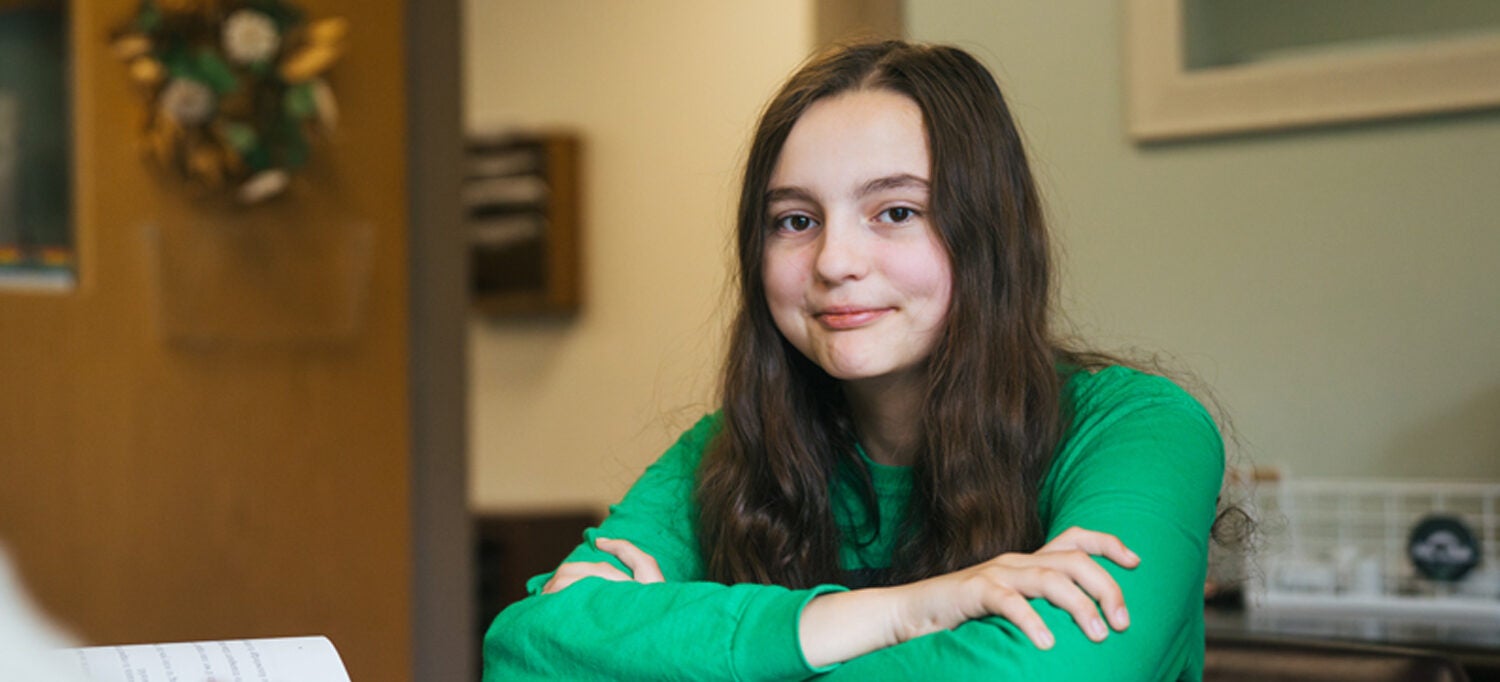 A young student meets with Marshall University HELP Center staff