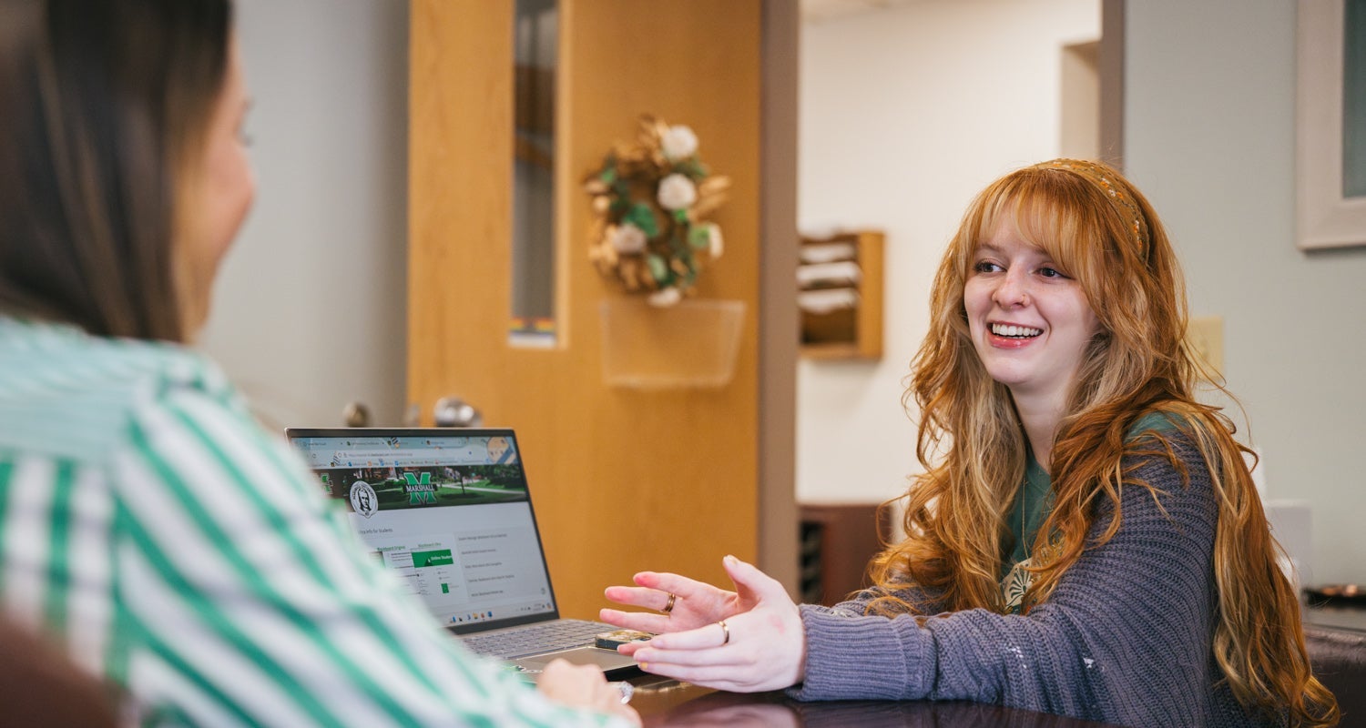 A College HELP student meets with HELP Center Staff