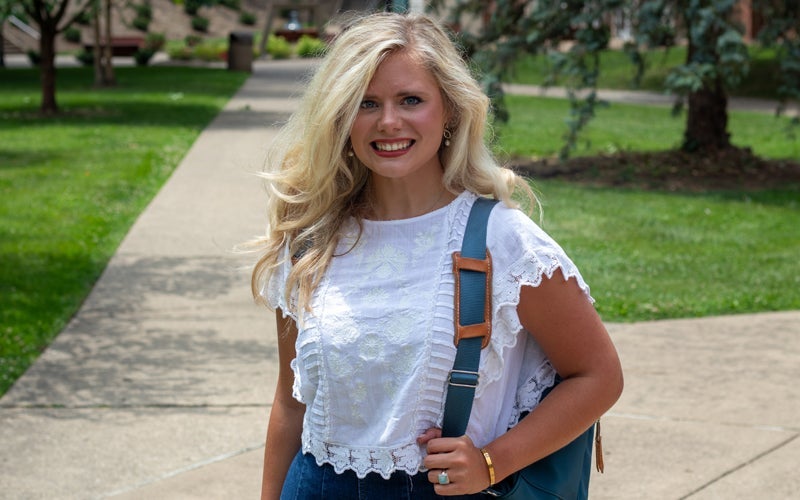 Marshall University HELP student stands on campus with a backpack ready to begin a Summer Prep session