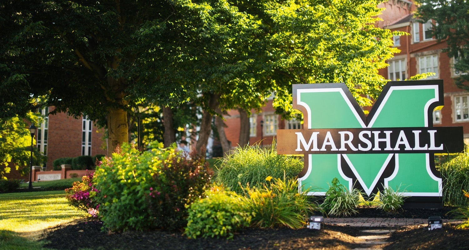 Large Marshall sign in front of Old Main on Marshall University's Huntington campus