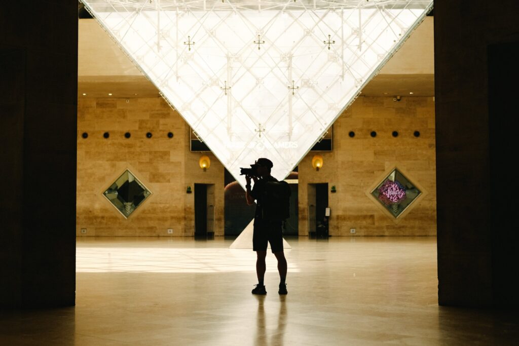 Andrew Ely taking photos in the Louvre Museum