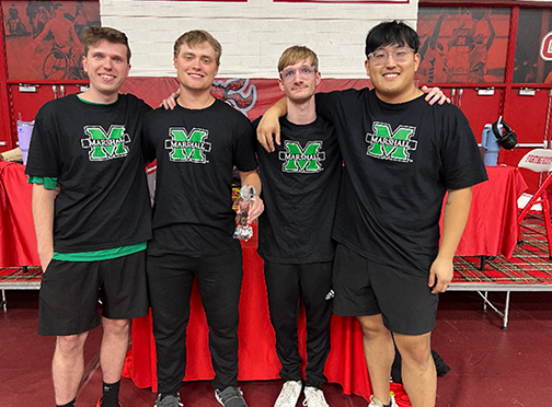 Marshall University E-sports team smiles for a group photo at a tournament