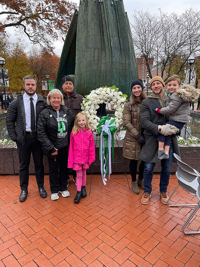 Joe, Tara, Mike, Mackenzie, Tiffany, Michael and Max Barbera in front of the Memorial Fountain at Marshall University