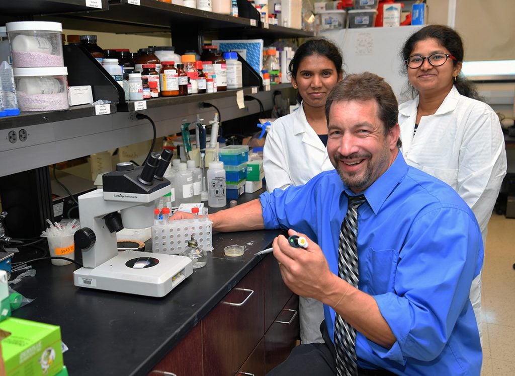 Photo of a Marshall University research team in the lab