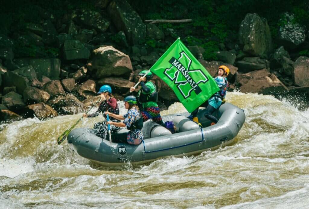 whitewater rafting with Marshall flag