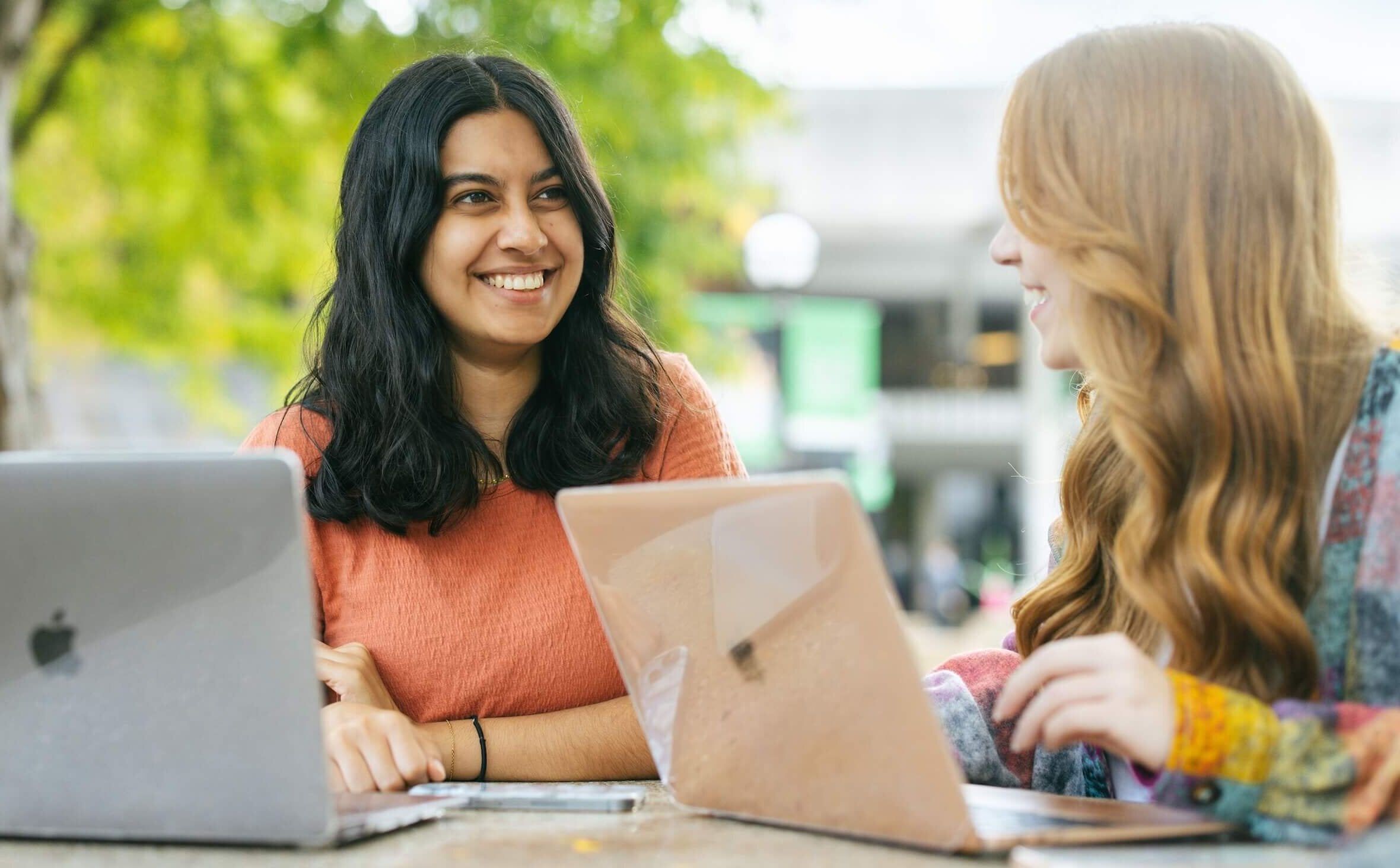 two students having a conversation outside