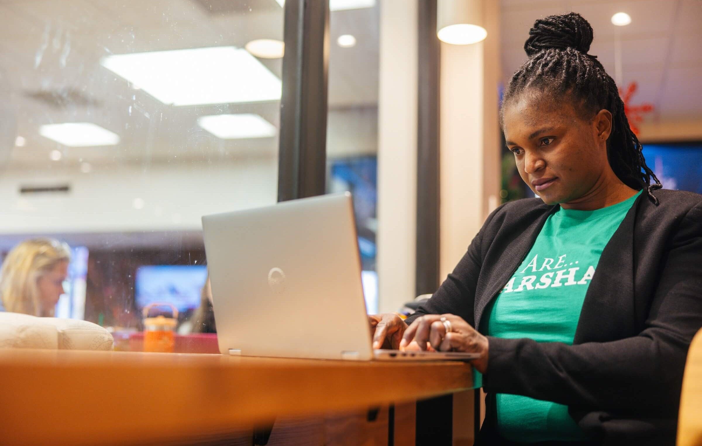 student working on a laptop in Starbucks