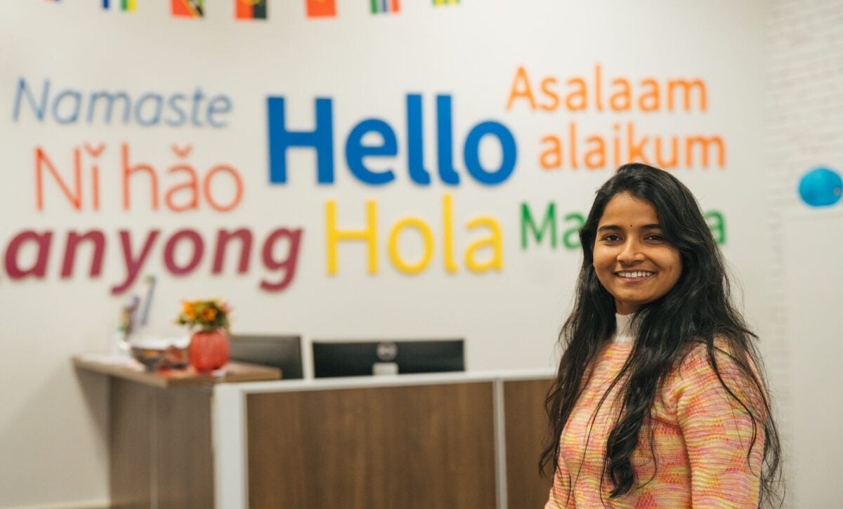 student smiling at the camera in East Hall