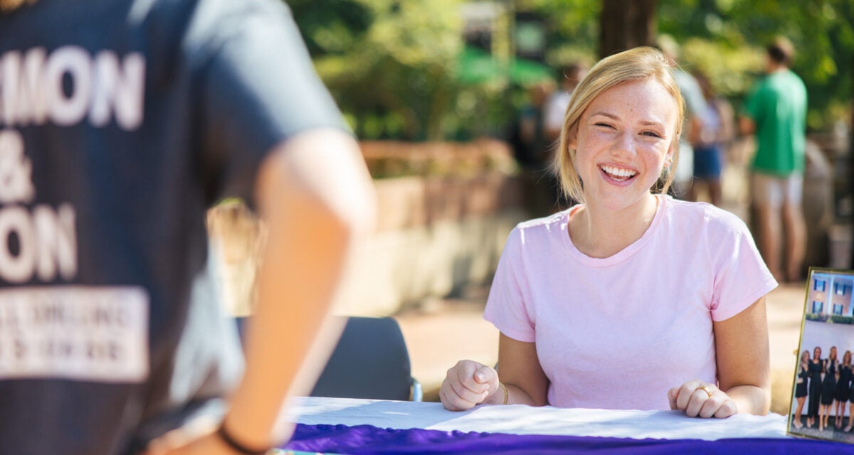 Student recruits members for a student organization on campus