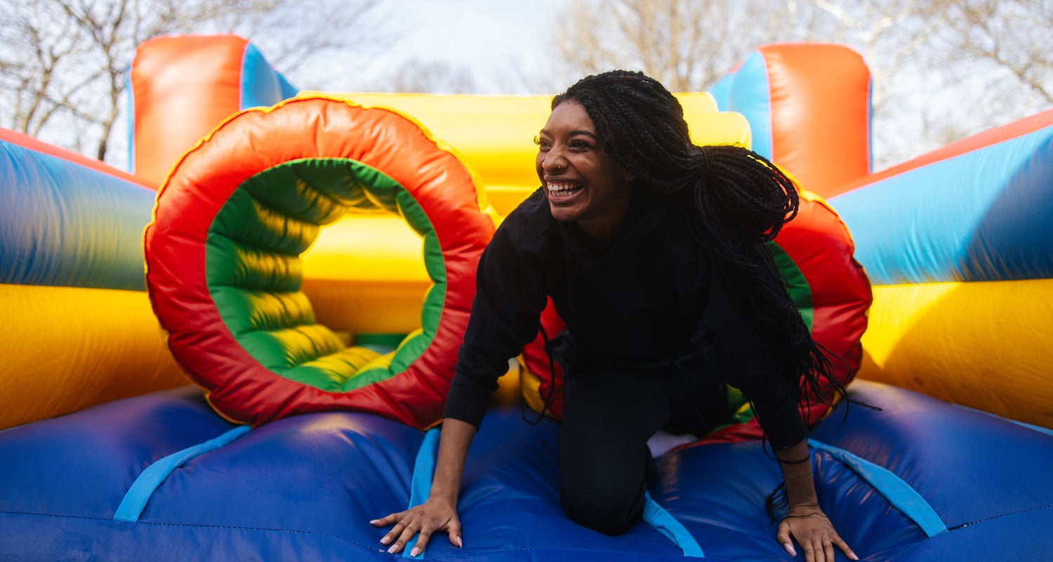 Student participates in an obstacle course on the Marshall University campus.
