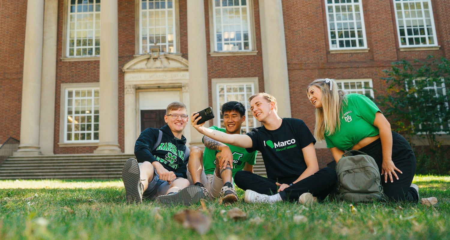 Students taking a selfie outside of an academic building on Marshall University's Huntington campus