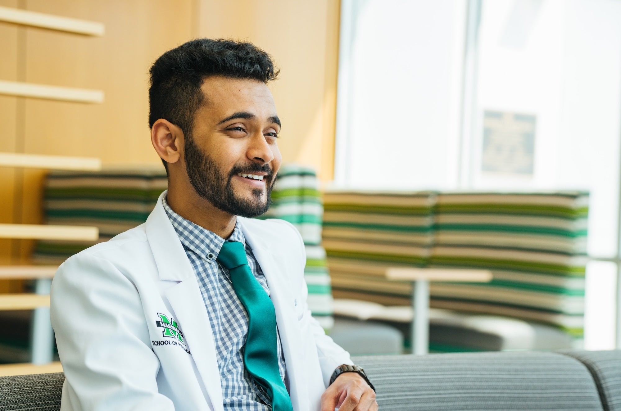 pharmacy student smiling and looking off camera