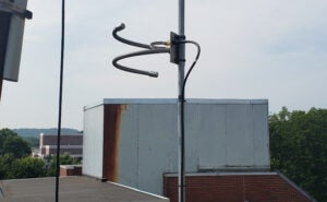 WMUL-FM's temporary radio antenna attached to a pole atop the Science Building.