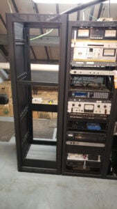 An empty equipment rack on the left. A full one on the right.