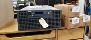 WMUL-FM's new transmitter sitting on a desk. A GatesAir Flexiva GX5K that is about the size of a microwave.