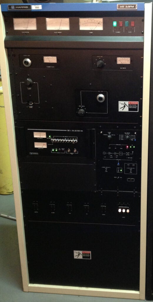 A radio transmitter. A Harris HT 3.K FM. It is about the size of a refrigerator.